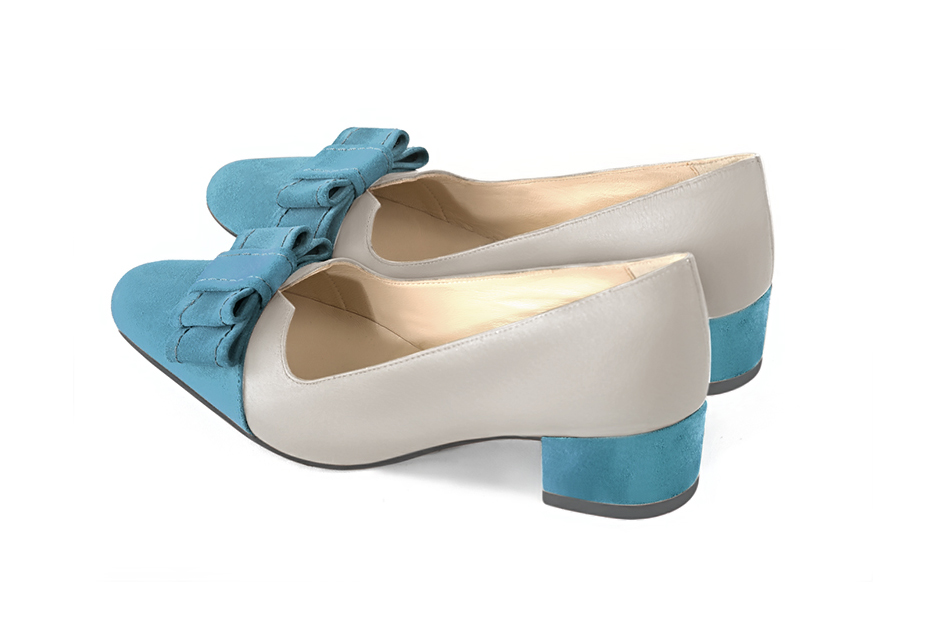 French elegance and refinement for these peacock blue and pearl grey dress pumps, with a knot on the front, 
                available in many subtle leather and colour combinations. Possibility to customize with your colors, materials and heels.
With its original cutout, this pretty fitted pump
will render you great services, combining comfort and distinction. 
                Matching clutches for parties, ceremonies and weddings.   
                You can customize these shoes to perfectly match your tastes or needs, and have a unique model.  
                Choice of leathers, colours, knots and heels. 
                Wide range of materials and shades carefully chosen.  
                Rich collection of flat, low, mid and high heels.  
                Small and large shoe sizes - Florence KOOIJMAN